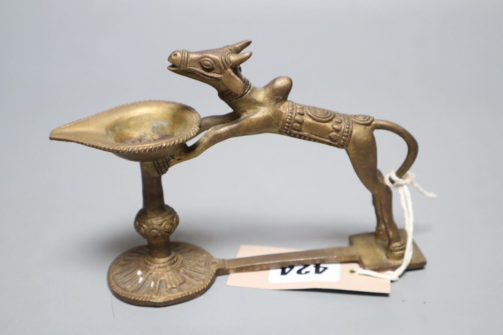 An Indian brass oil lamp